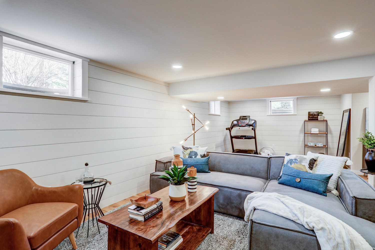 Lancaster Basement Remodel with living room and workout area