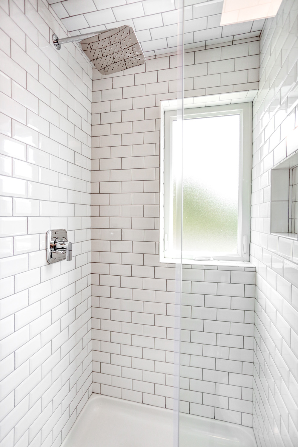 Tile shower with chrome shower head in Lancaster City Bathroom Remodel