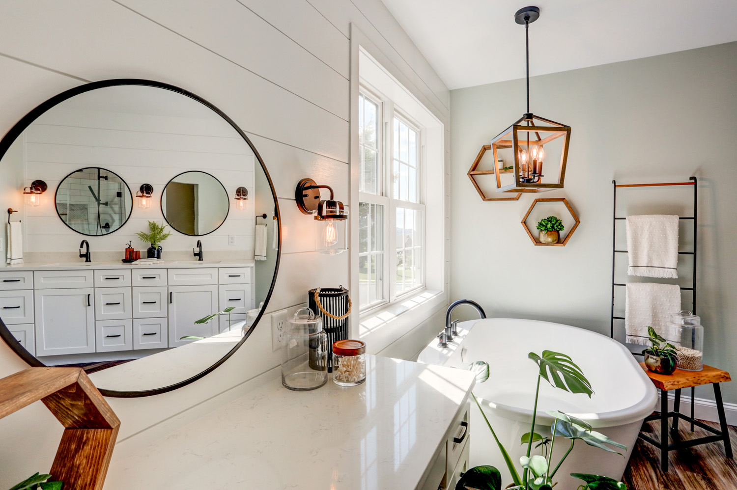 Circular mirror with matte black accents in Landisville Master Bathroom Remodel
