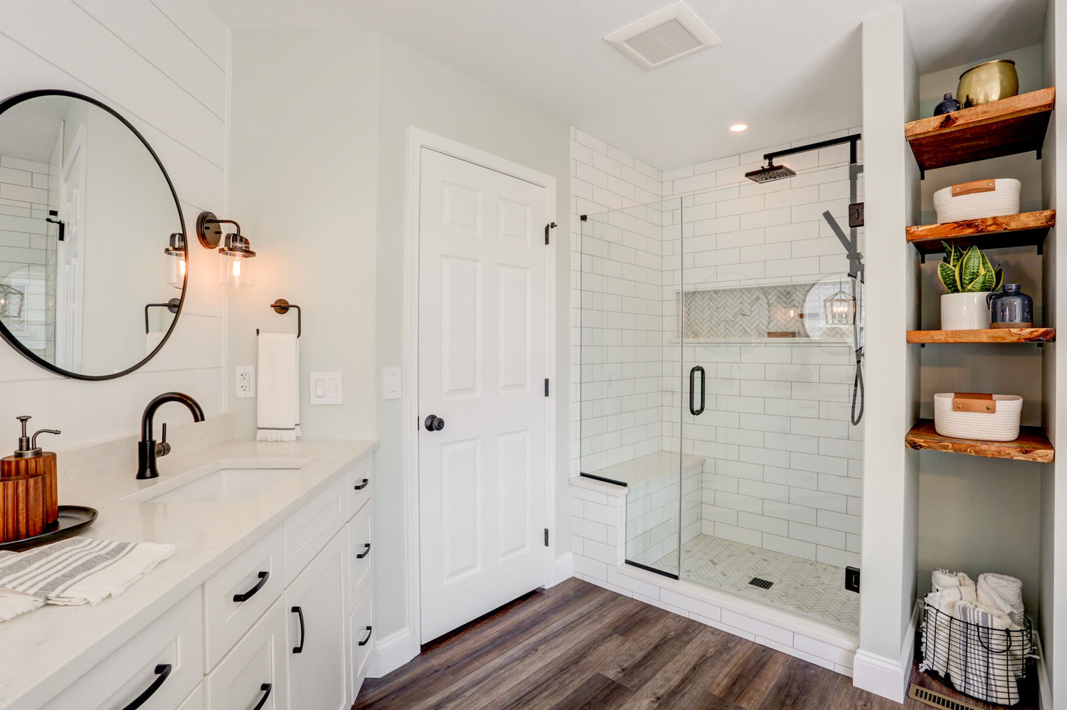 Landisville Master Bathroom Remodel with glass enclosed shower and matte black and wooden accents