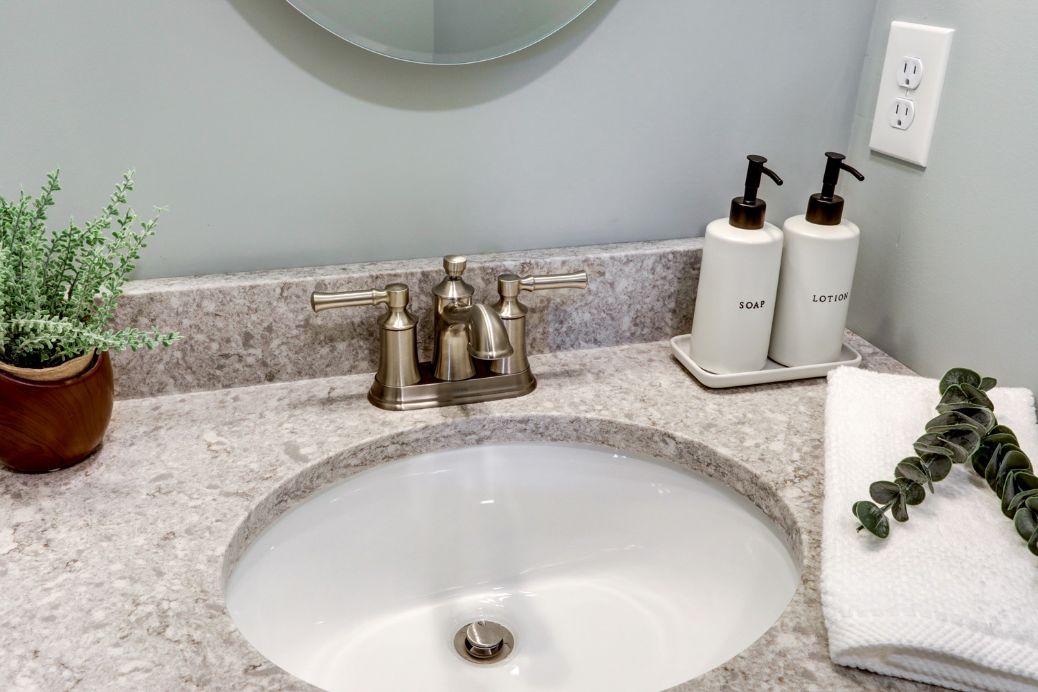 Gray quartz and brushed nickel faucet in Lititz Powder Room Remodel