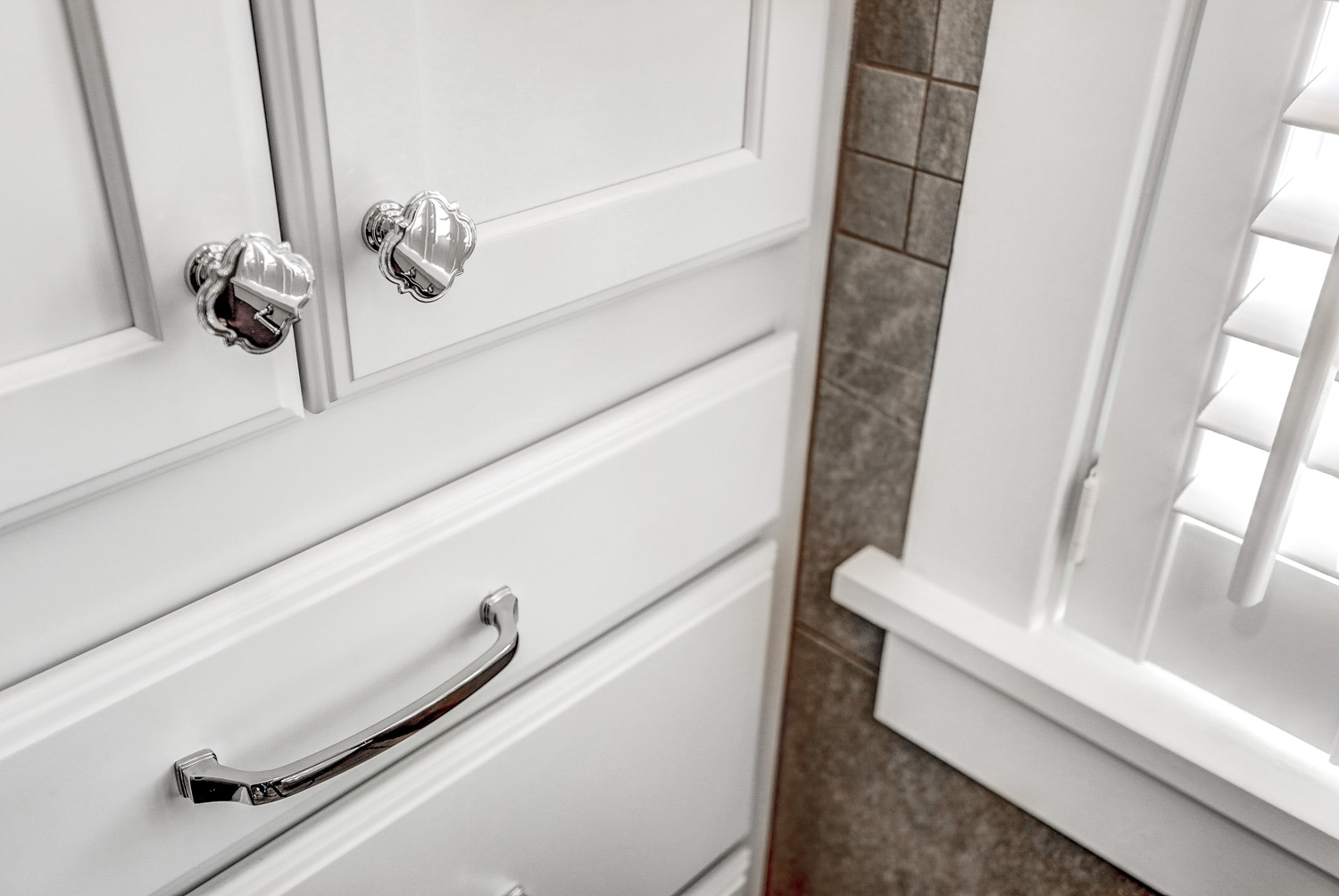 Chrome hardware on storage cabinets in Manheim township bathroom remodel