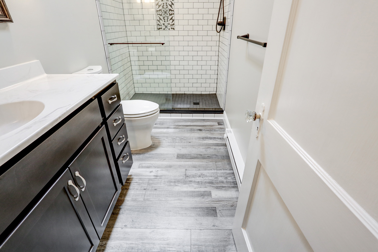 Gray Vinyl Plank Floors in Lancaster Bathroom Remodel