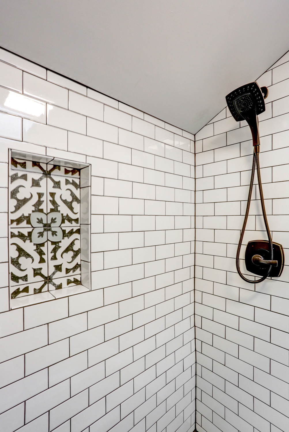 Tile shower with design tile in shower niche in Lancaster Bathroom Remodel