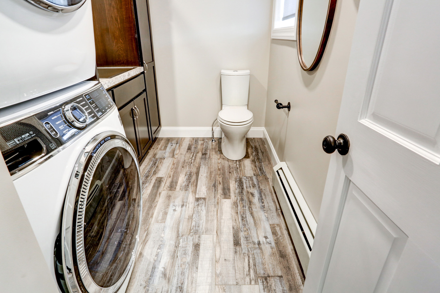 Gray vinyl plank flooring in Lancaster Laundry Room Remodel