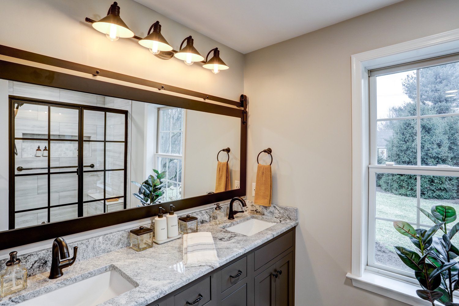 Manheim Township Bathroom with granite countertop and matte black mirror