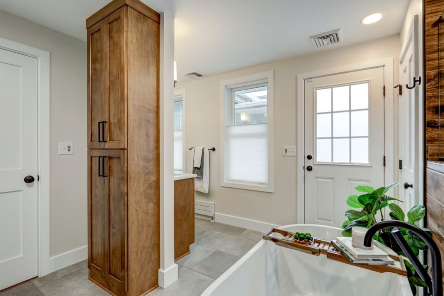 Lancaster Bathroom Remodel with wood linen cabinet