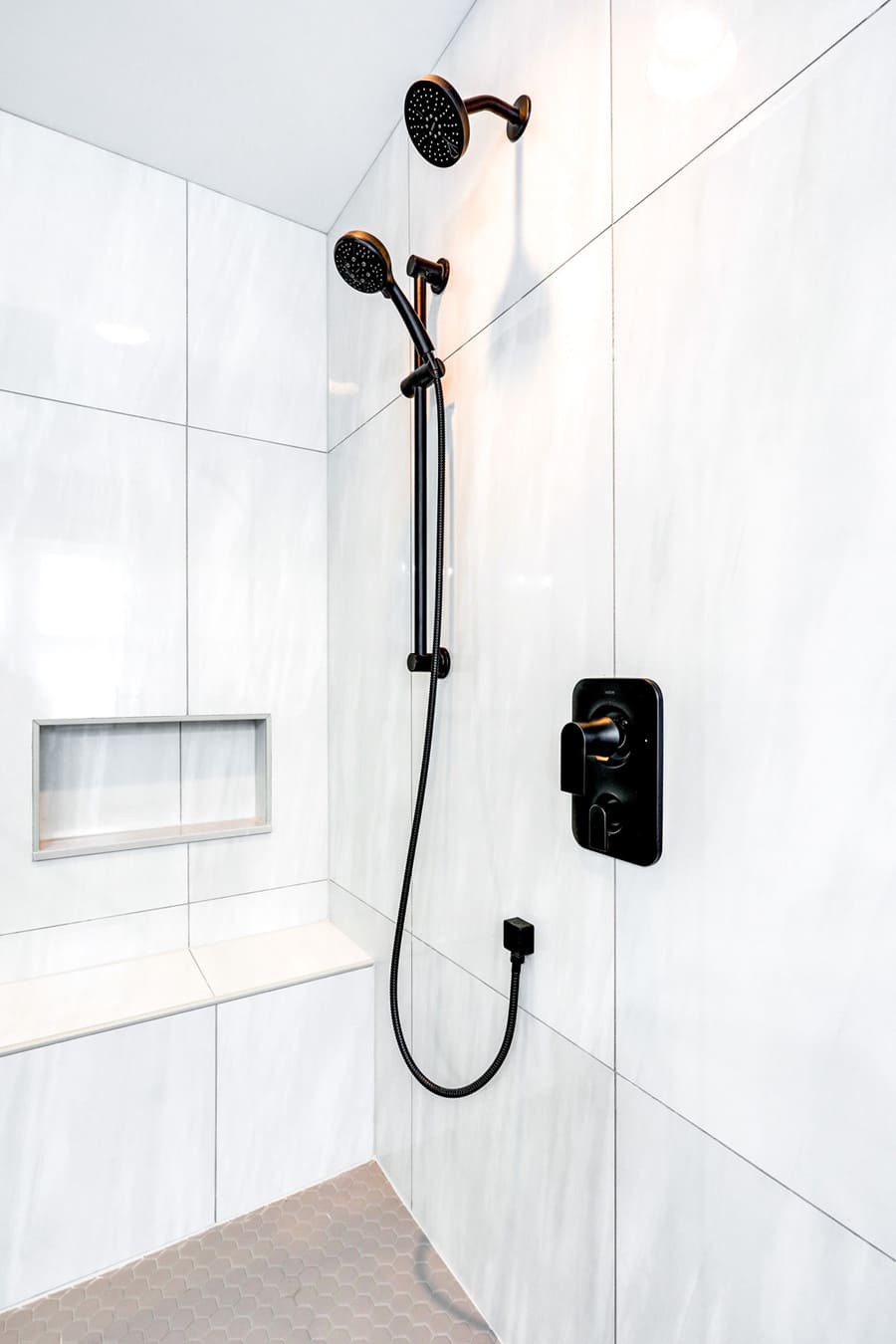 matte black accents and shower bench in Lititz primary bathroom remodel 