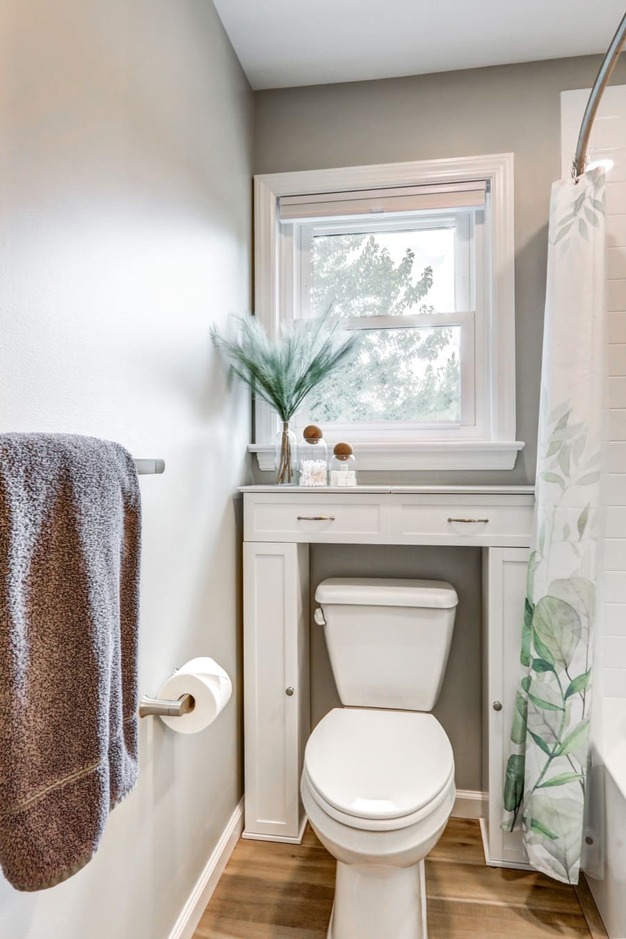 Lititz kids bathroom remodel with custom over toilet storage