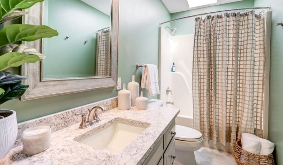 Bathroom remodel with light green walls