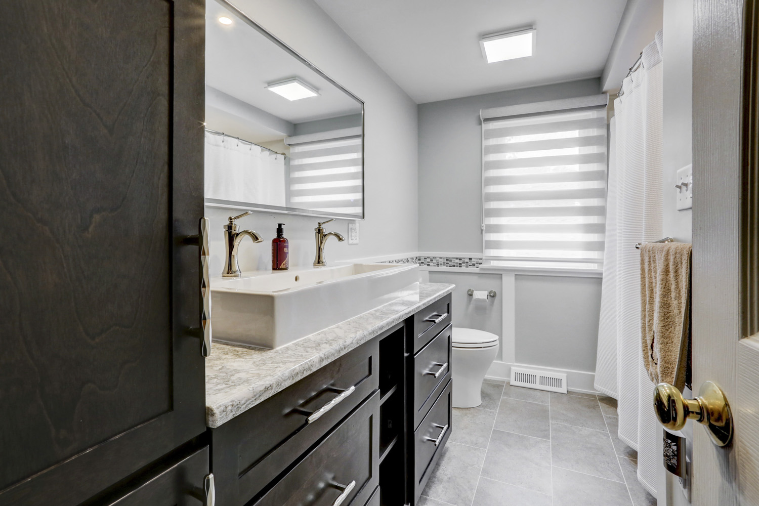 Bathroom remodel with double vessel sink