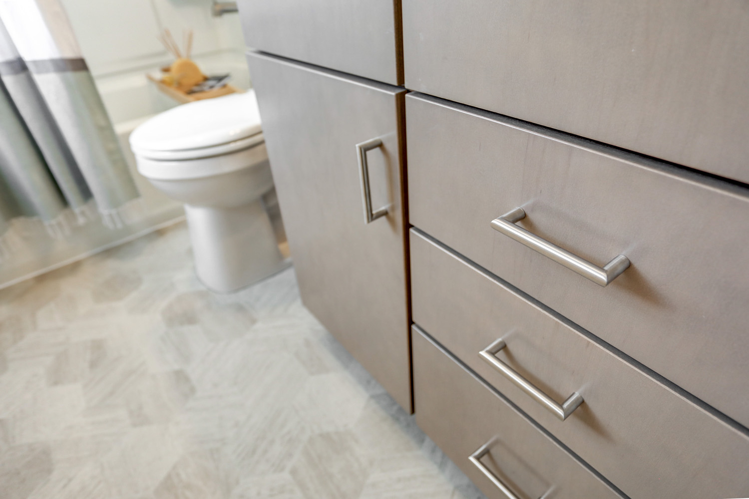 Gray vanity with brushed nickel drawer pulls in Manheim Township Bathroom Remodel 