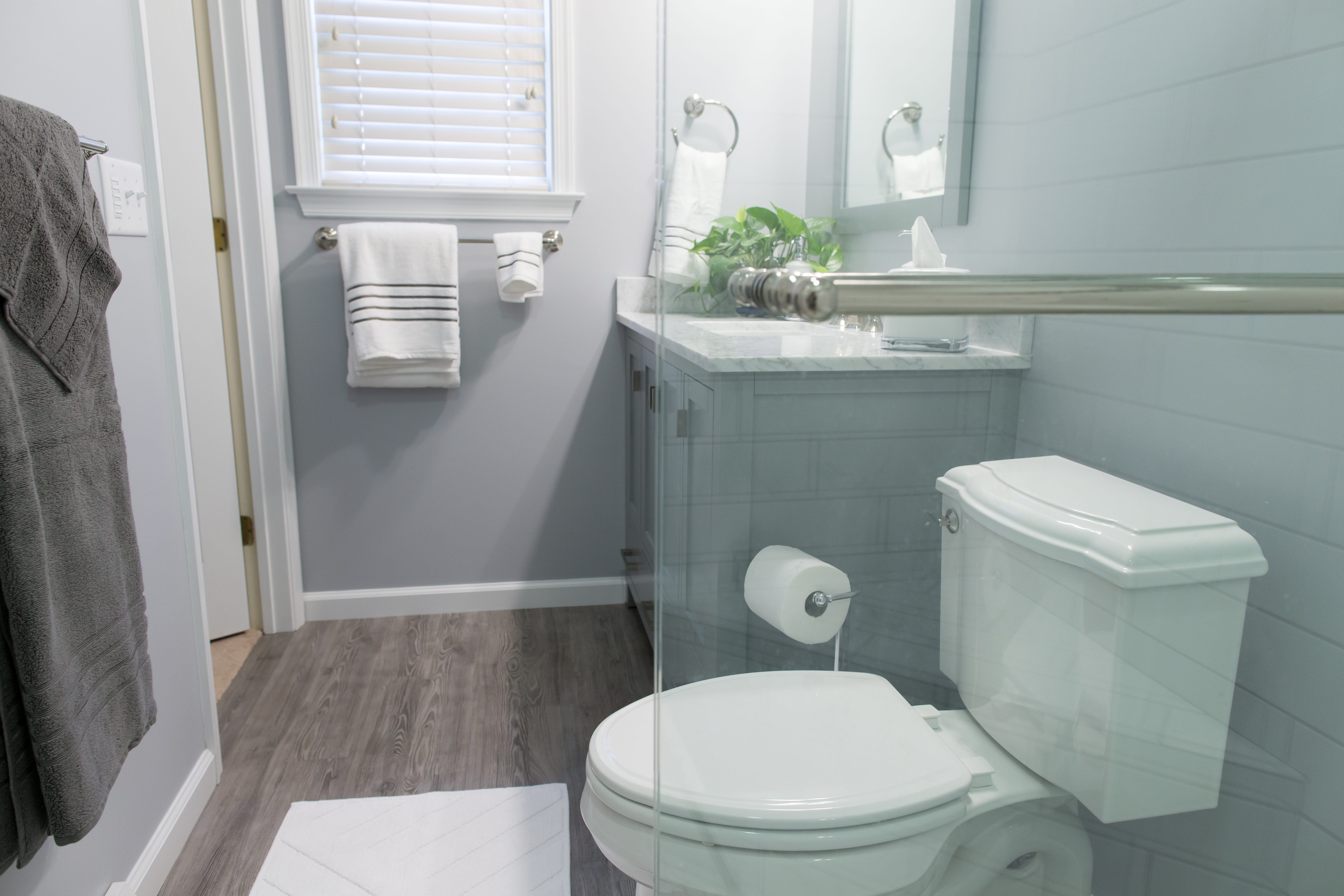 Compact master bathroom remodel with gray finishes