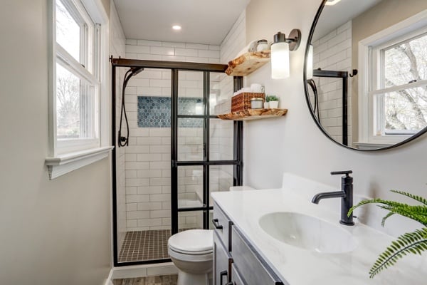 Small bathroom with farmhouse shower door