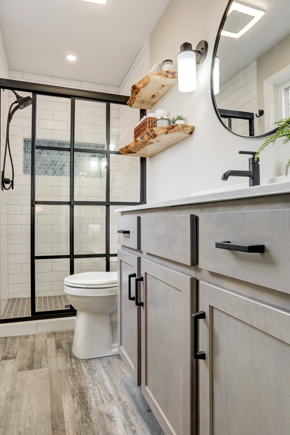 Gray vanity with matte black hardware in Lancaster Master Bathroom Remodel