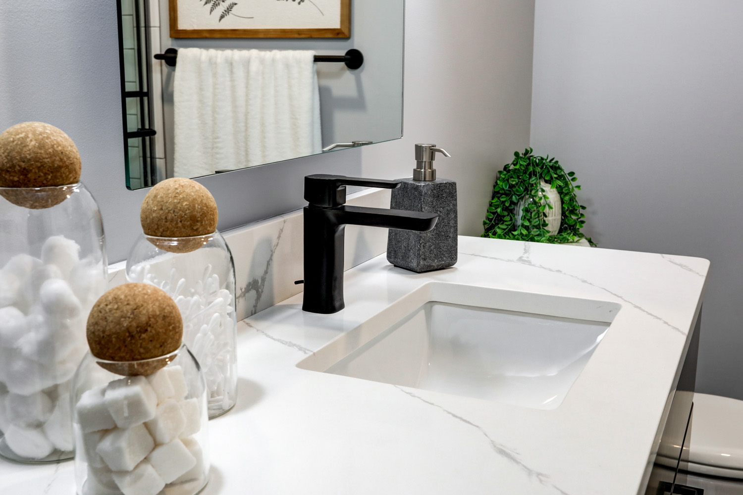 Quartz countertop and matte black faucet in Lancaster City Guest Bathroom