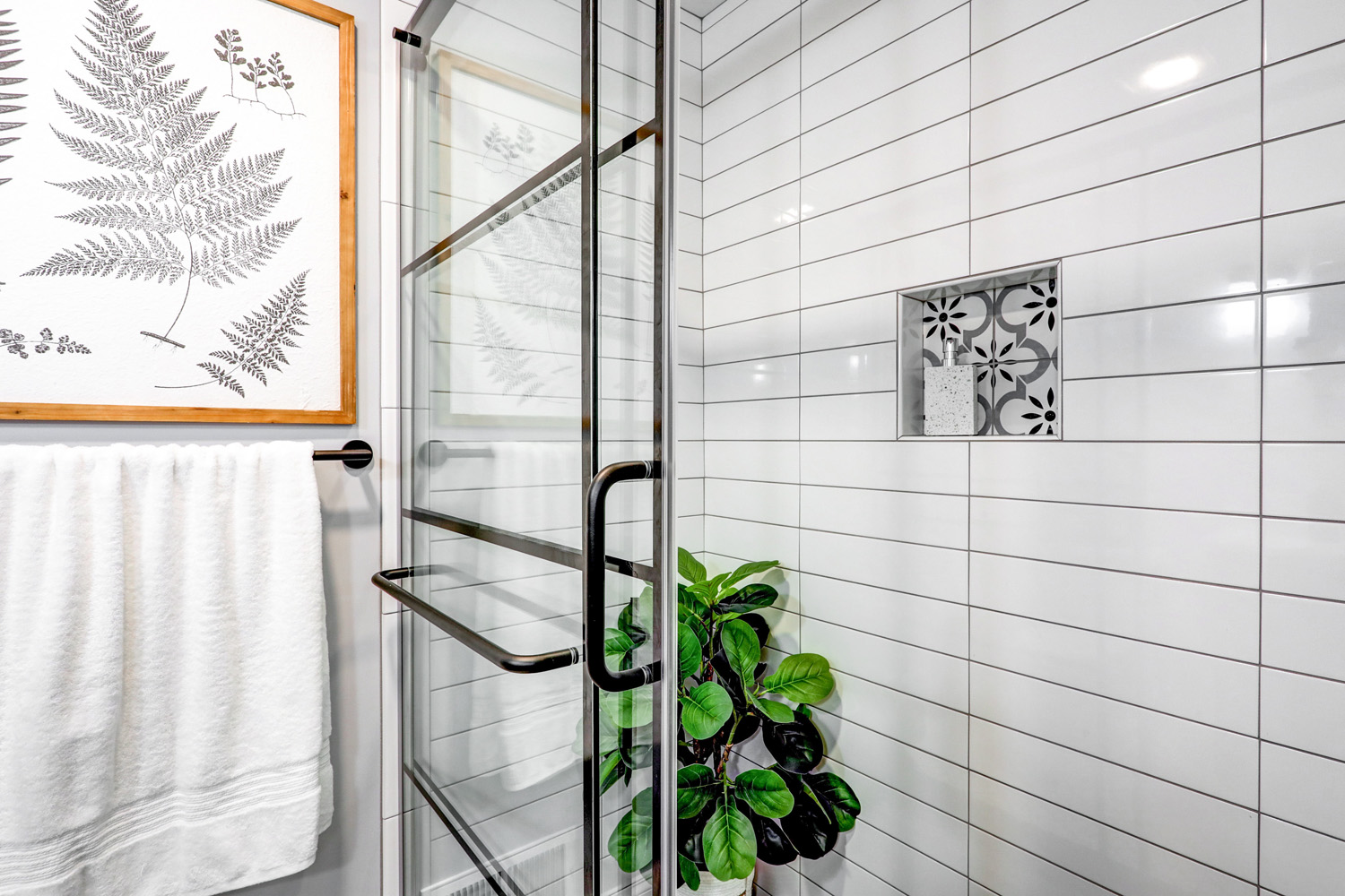 Tile shower with niche in Lancaster City Guest Bathroom