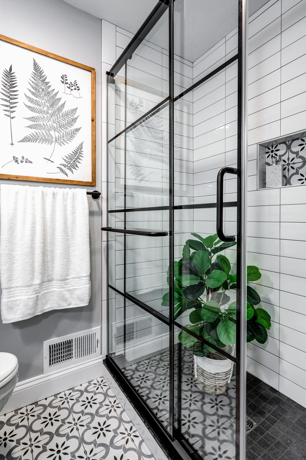 Grid shower doors and tile floors in Lancaster City Guest Bathroom