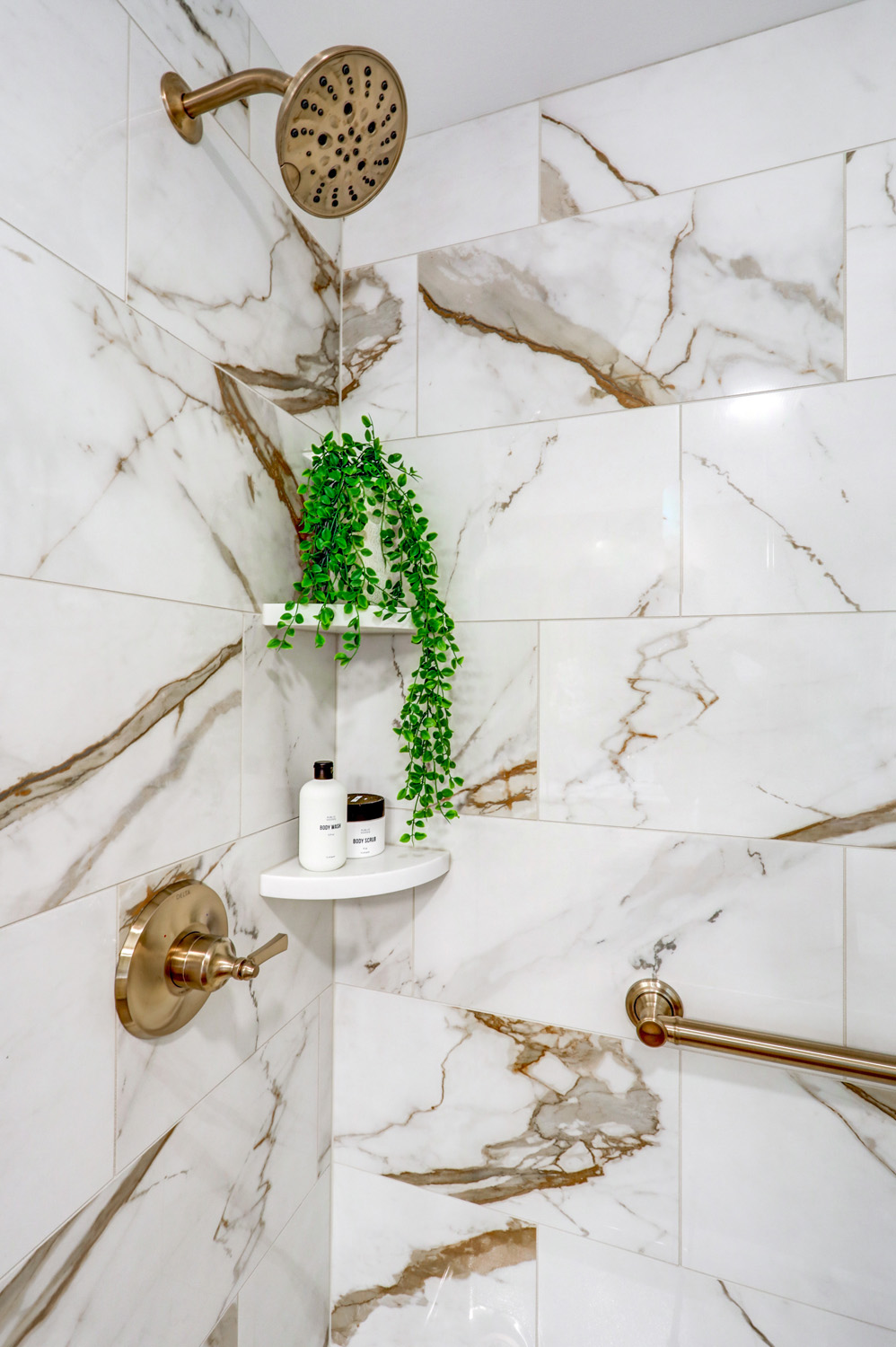 Tile shower with champagne bronze faucet in Manehim Township Bathroom remodel