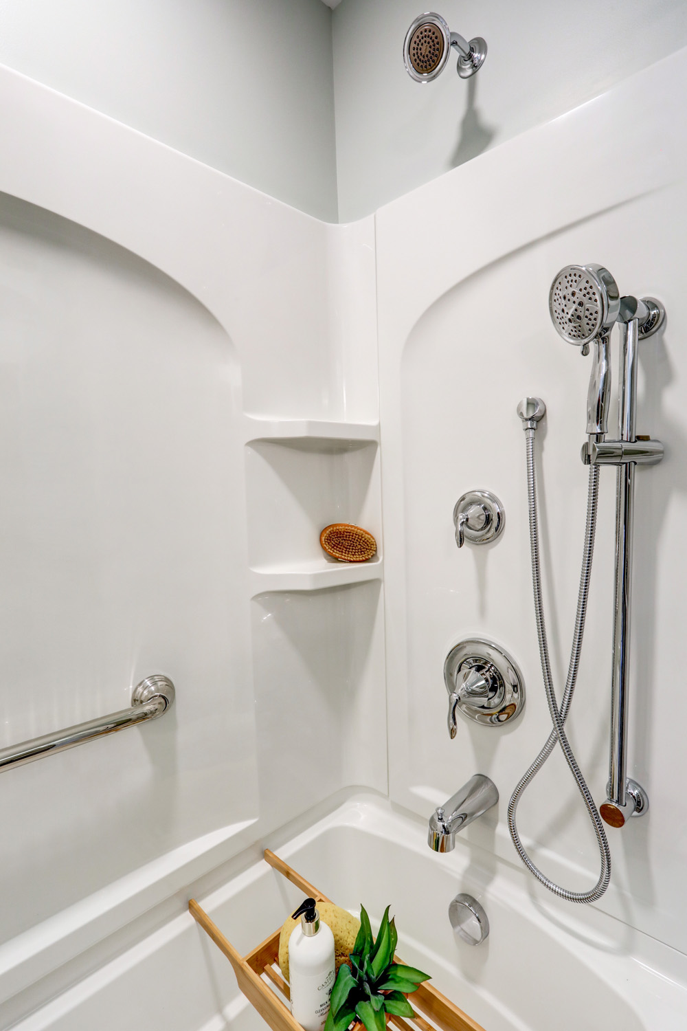 Chrome fixtures in shower and bath combo in Willow Street Master Bathroom Remodel