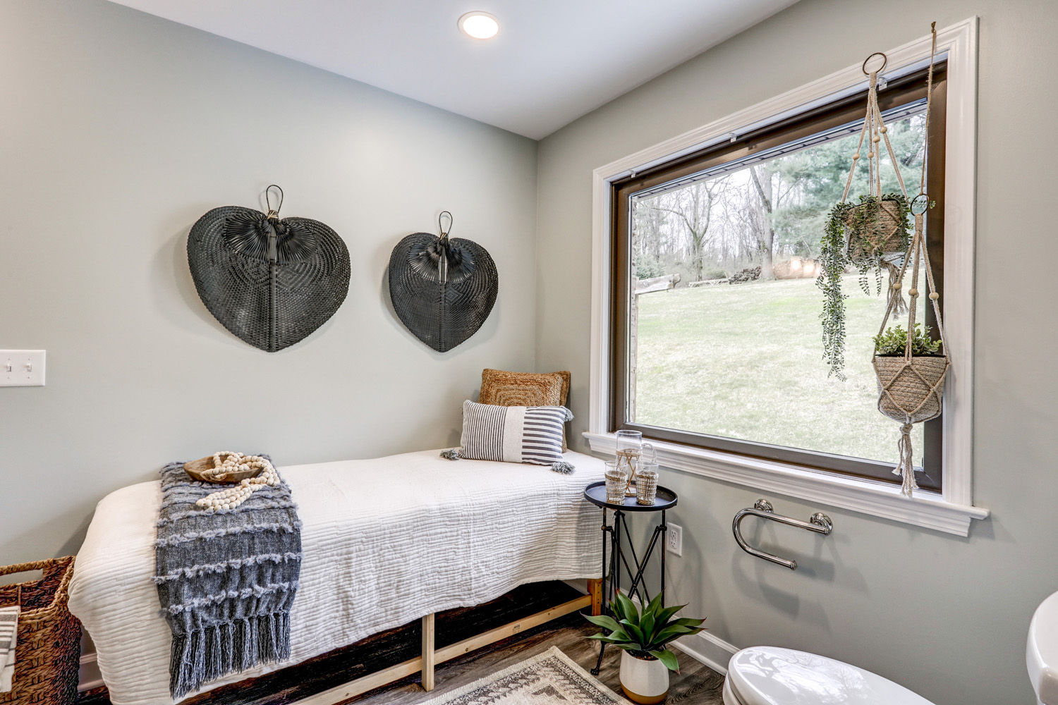 Massage bed and large window in Willow Street Master Bathroom Remodel