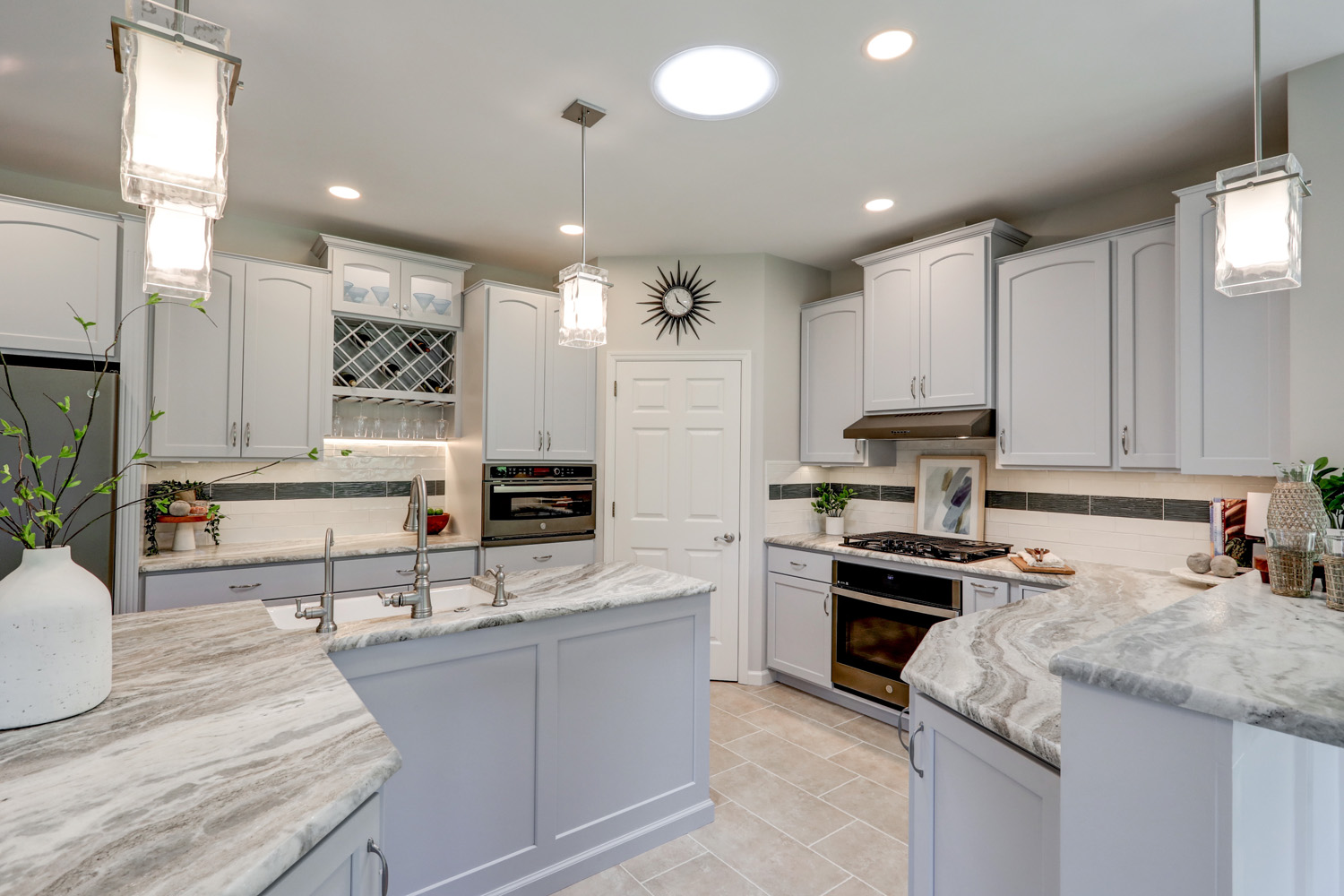Conestoga Valley Kitchen Remodel with gray cabinets and marble countertops
