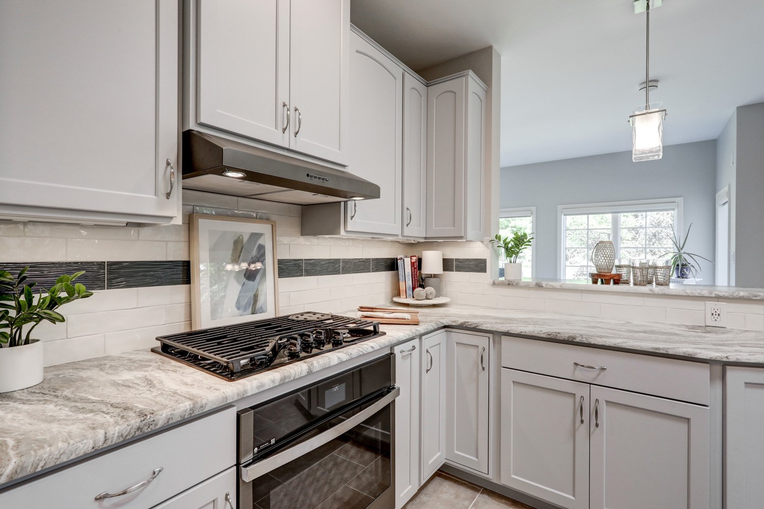 Gray cabinets and stainless steel appliances in Conestoga Valley Kitchen Remodel