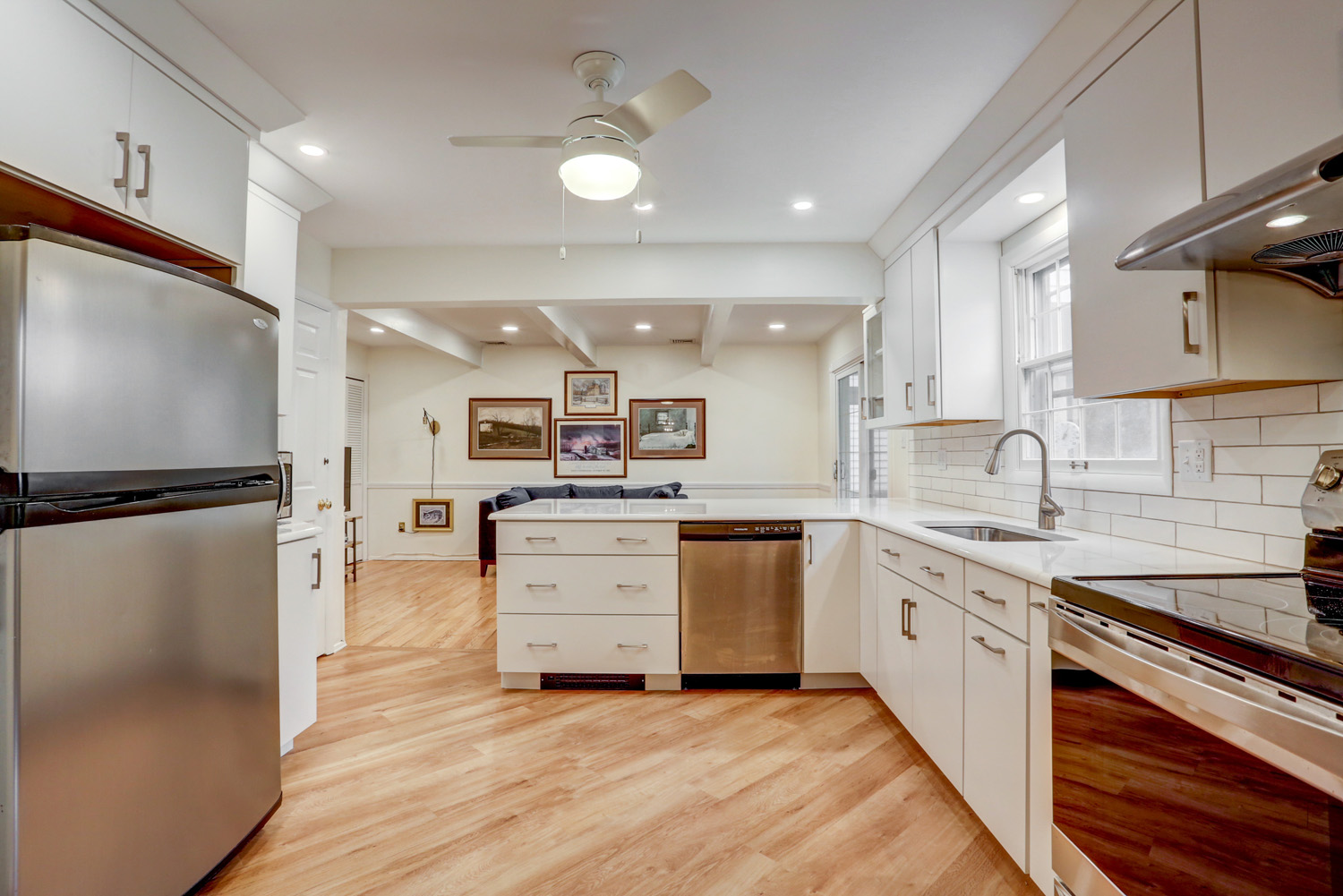 Kitchen remodel with white cabinets and wood accents in Lancaster PA