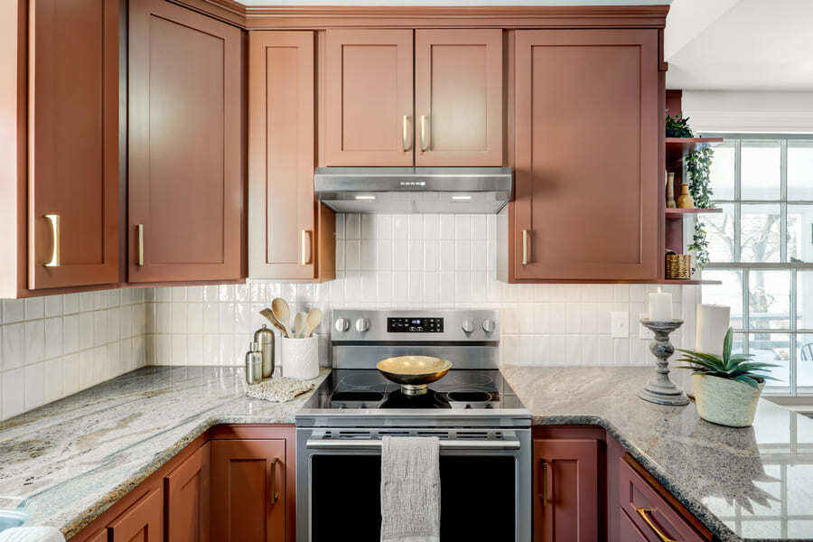 Lancaster Kitchen Refresh granite countertops and cherry cabinets with gold hardware