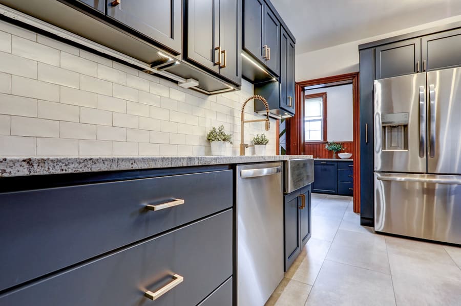 Mount Joy Kitchen Remodel with blue cabinets and gold accents