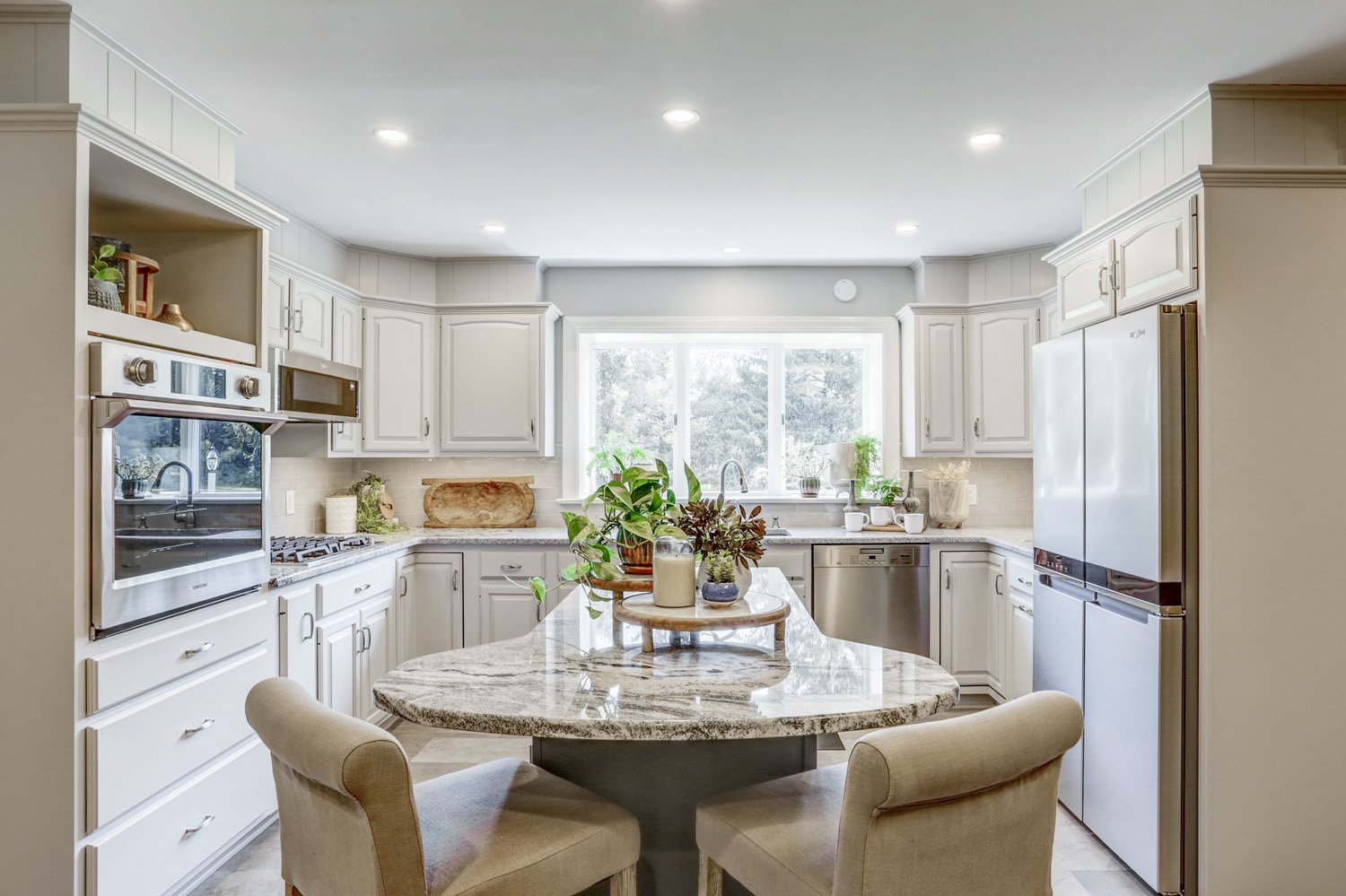 Conestoga Valley Kitchen Remodel with Island Seating and bright lighting