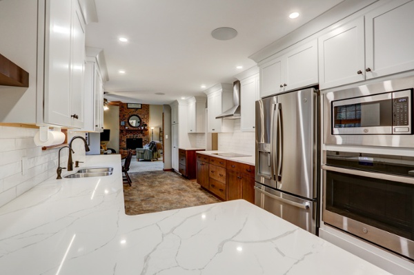 Kitchen remodel with white and gray granite countertops