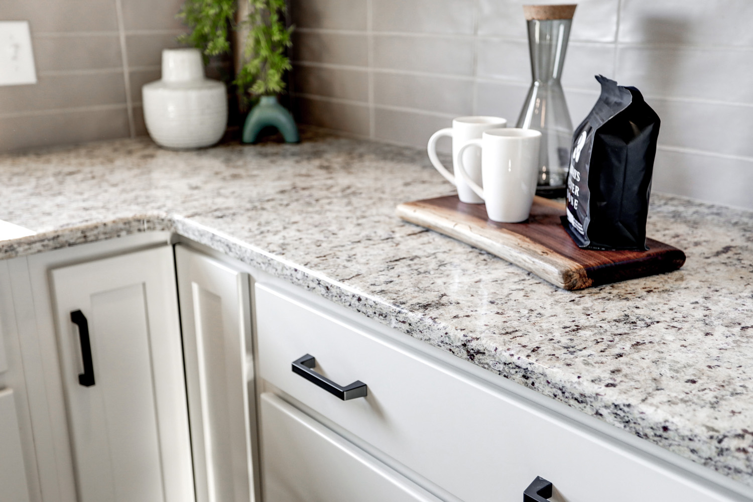 Granite counter top with white cabinets in Paradise Kitchen Remodel