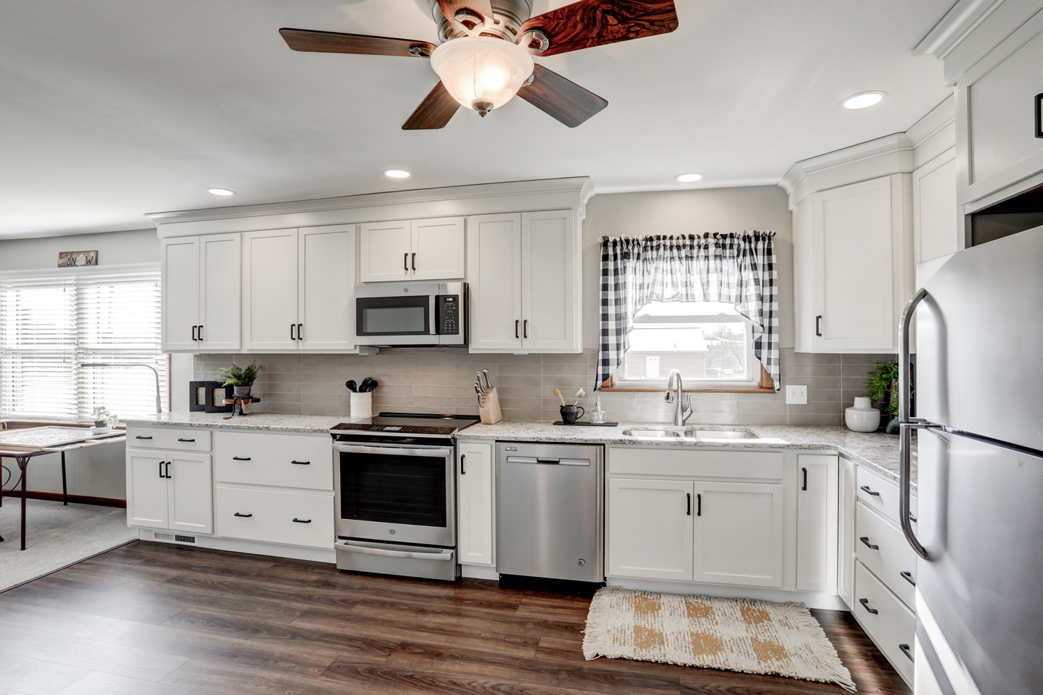 White cabinets with stainless steel appliances in Paradise Kitchen Remodel