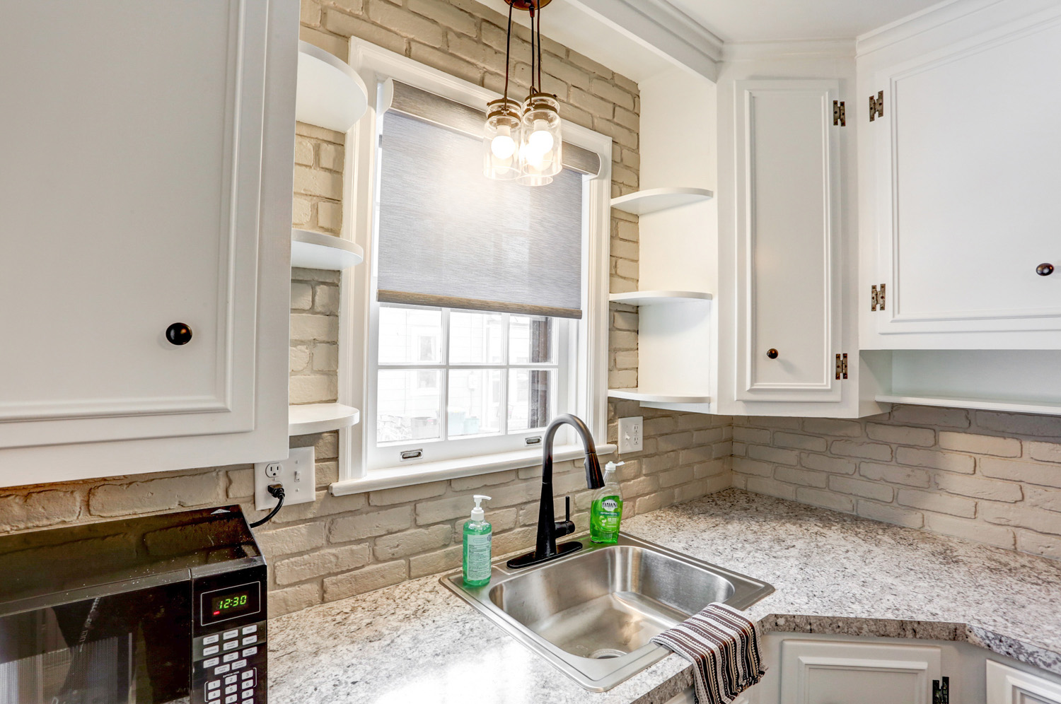 Lancaster Kitchen Facelift with white cabinets and laminate counterop