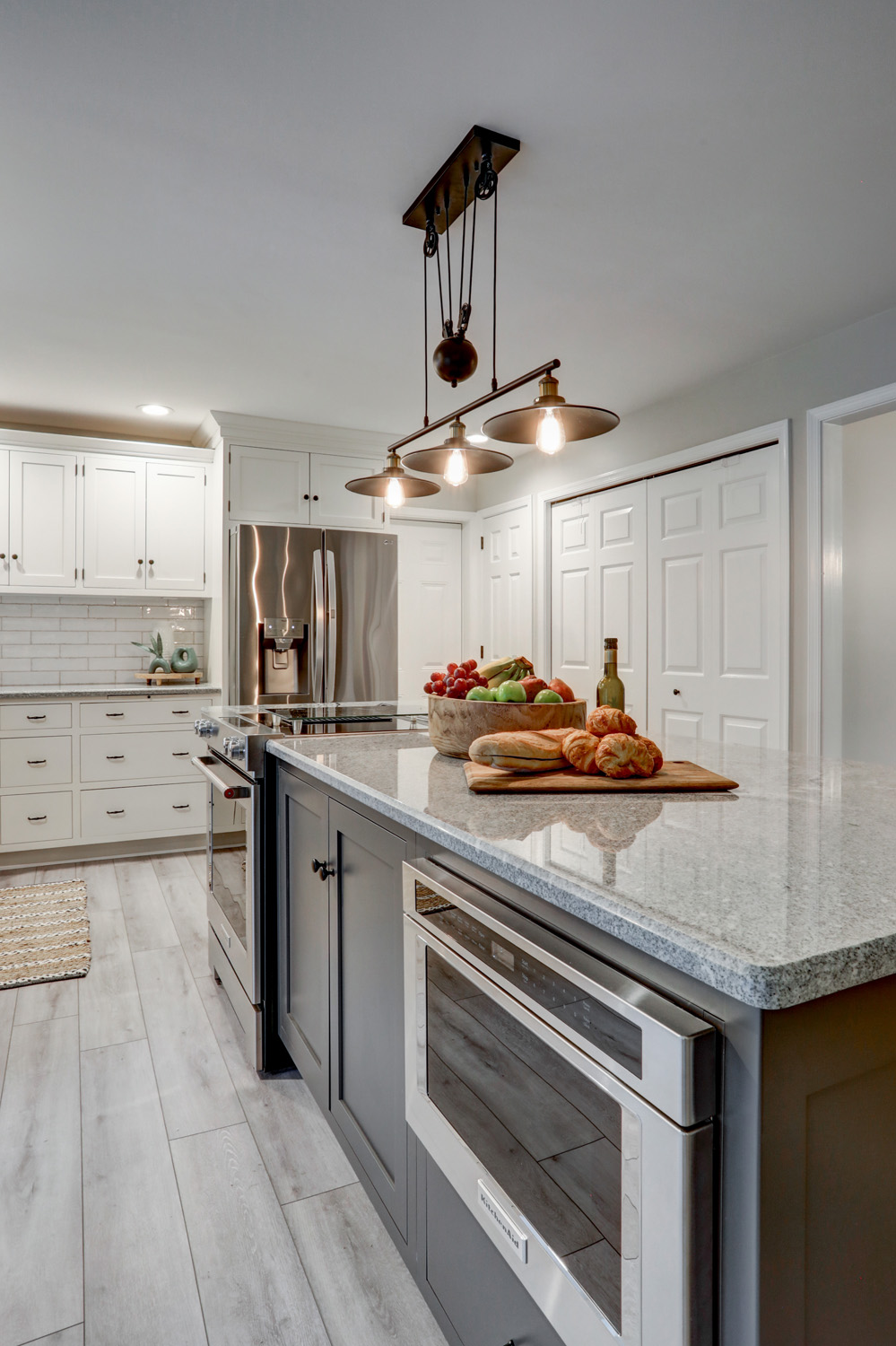 Island with stainless steel appliances and matte black light fixture in Manheim Township Kitchen Remodel