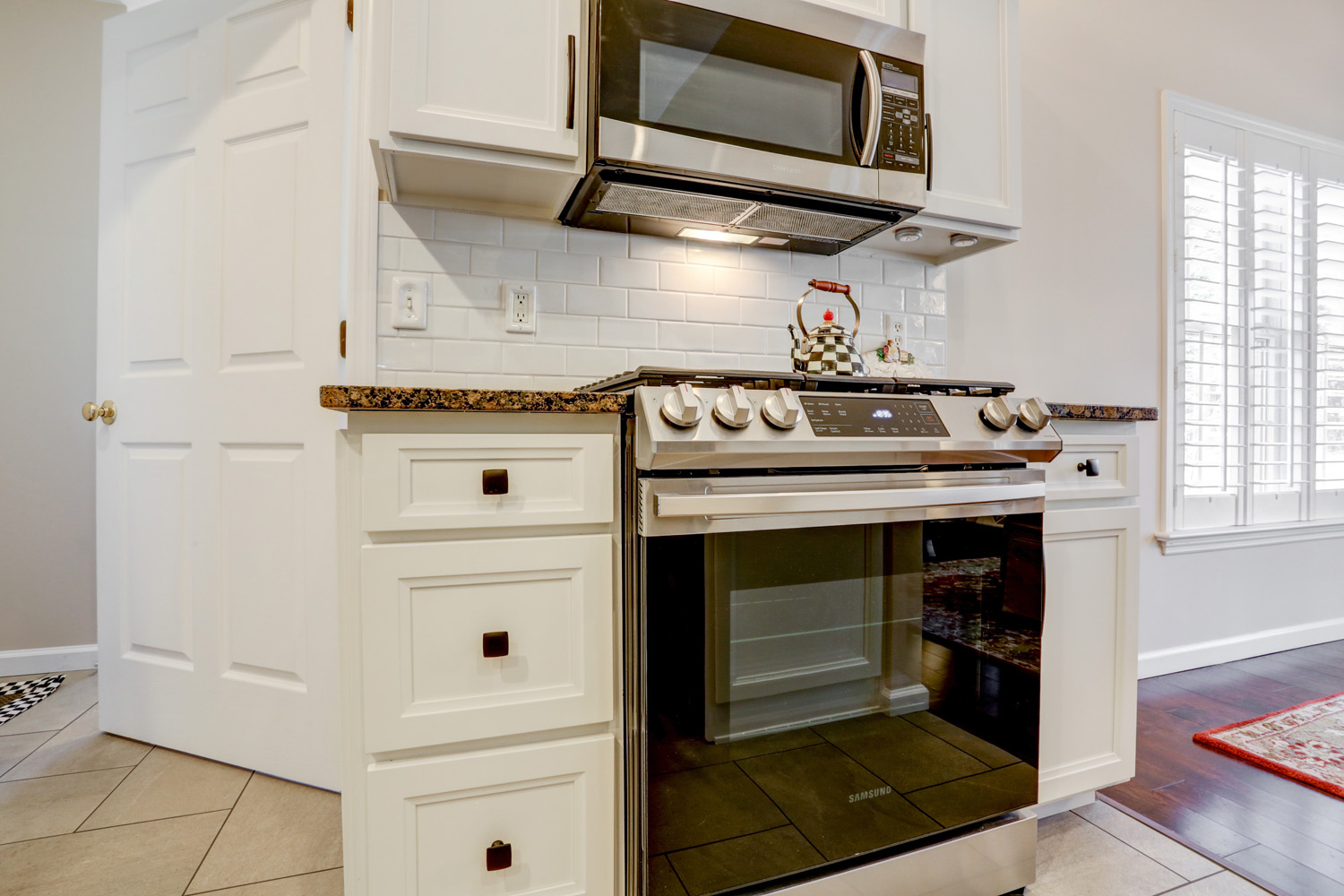 White Cabinets with Bronze Hardware in Manheim Central Kitchen Remodel