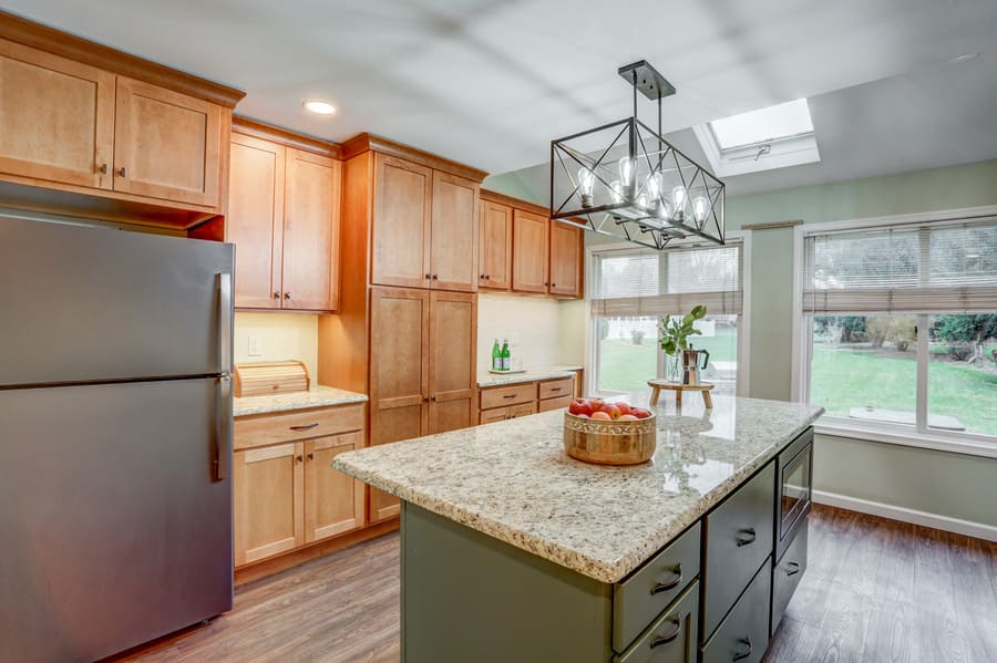 Hempfield Kitchen Remodel with dark green island and brown cabinets