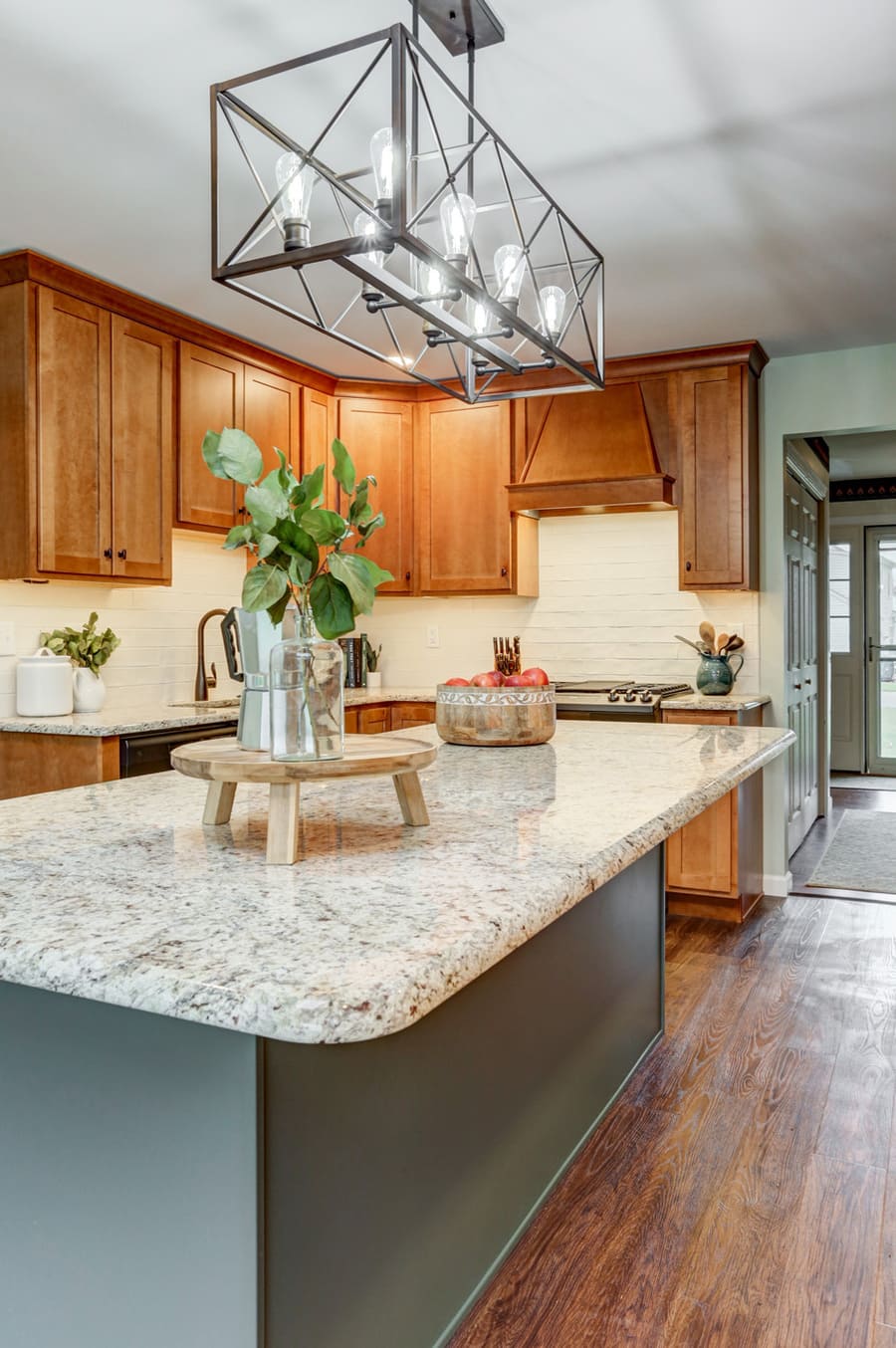 Green island with granite countertops in Hempfield Kitchen Remodel