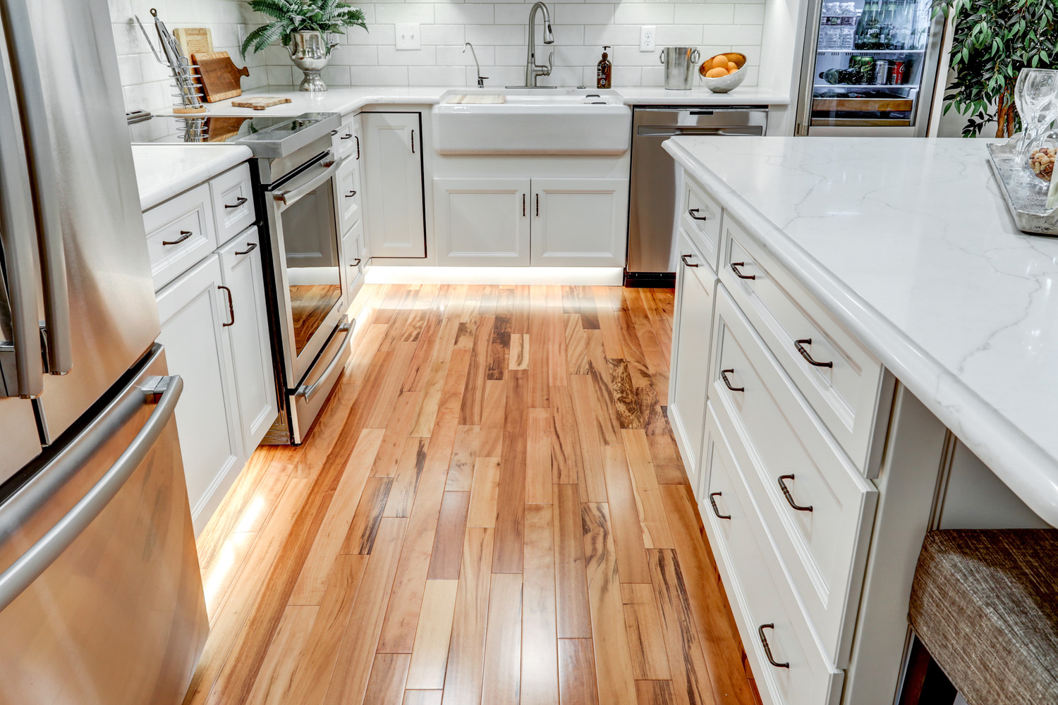 Leola kitchen remodel with toe kick lighting and hardwood floor