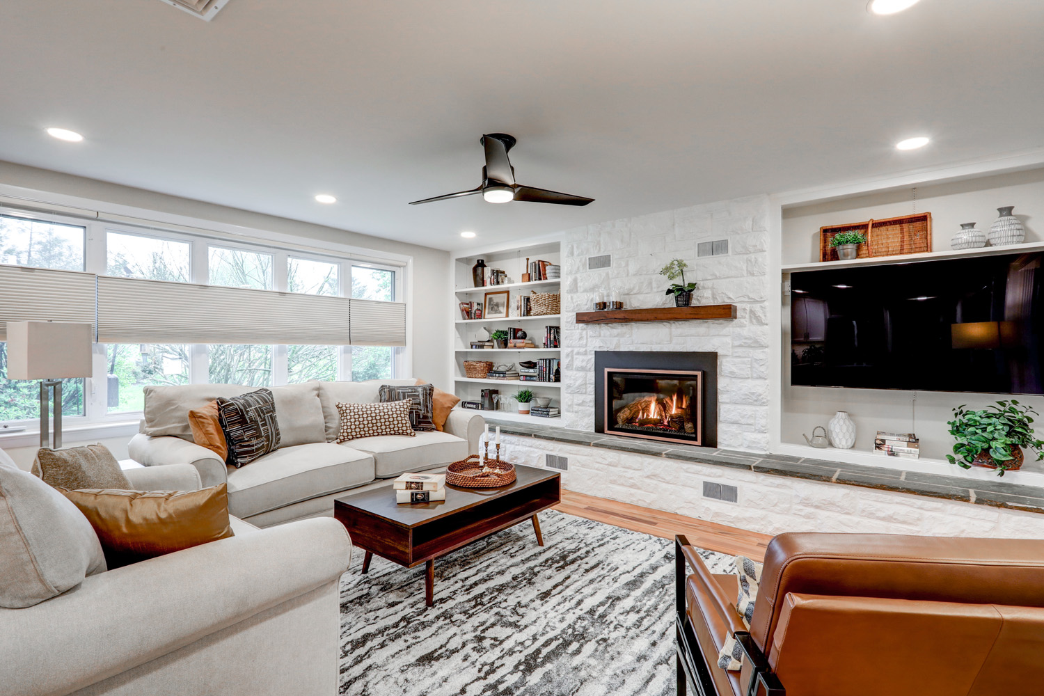 Leola family room remodel with gas fireplace and large white stone surround