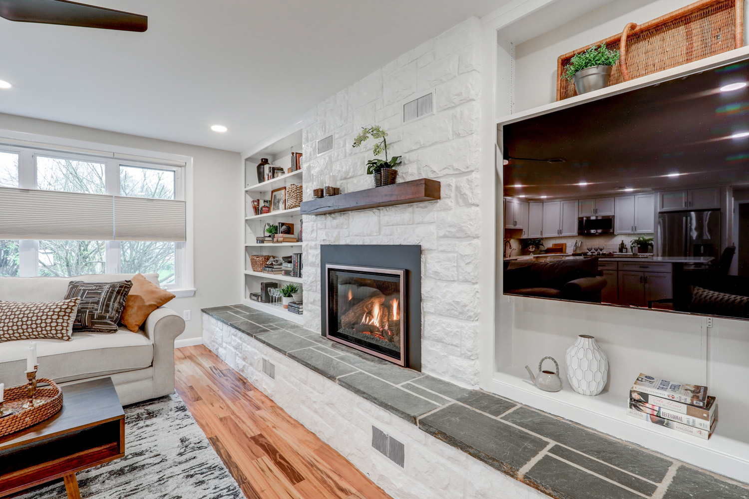 Updated fireplace surround with white built in shelves