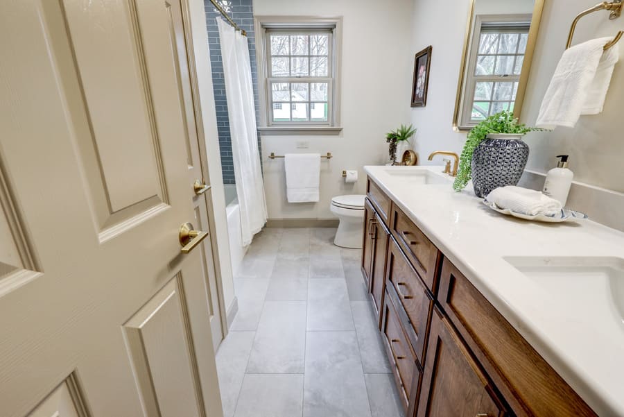Strasburg Guest bathroom Remodel with double wood stained vanity