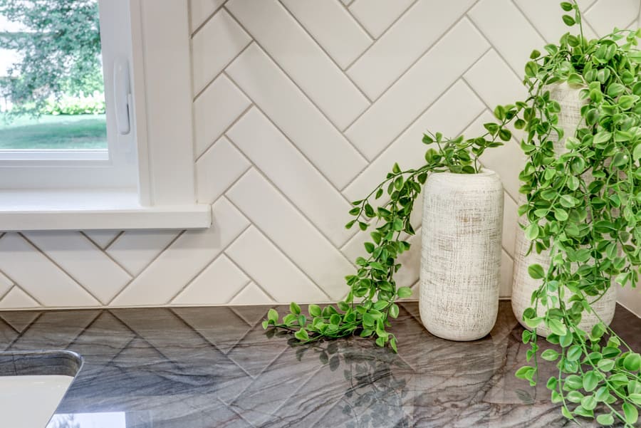 black countertop and white herringbone tile in Manheim Township Kitchen Remodel