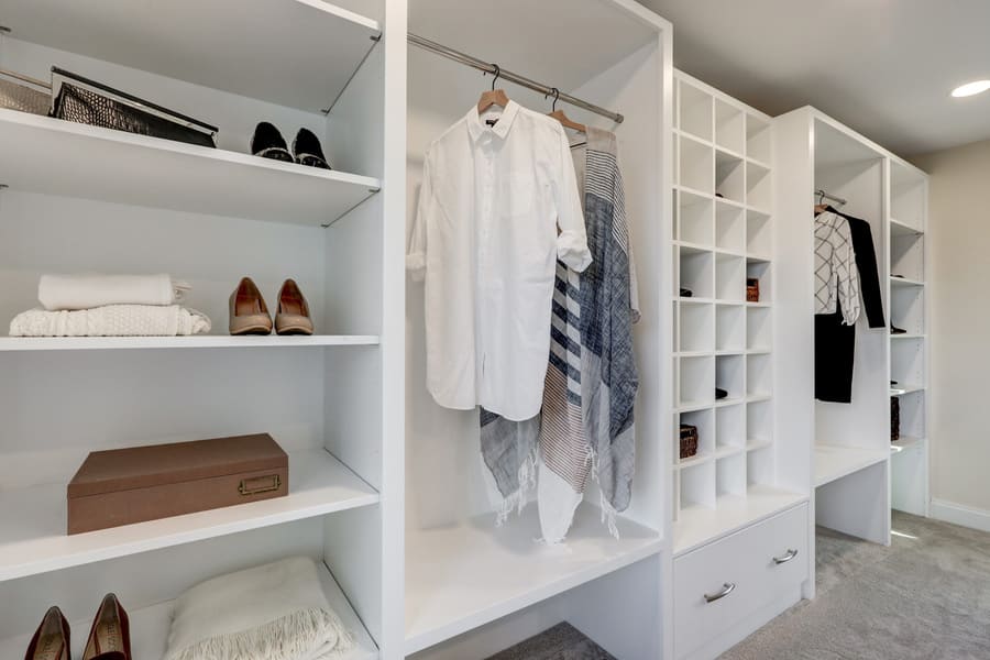 Walk in closet with custom shelving in manehim