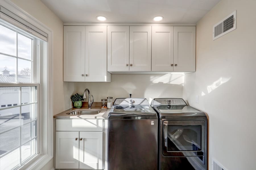 White cabinetry in manehim laundry room remodel