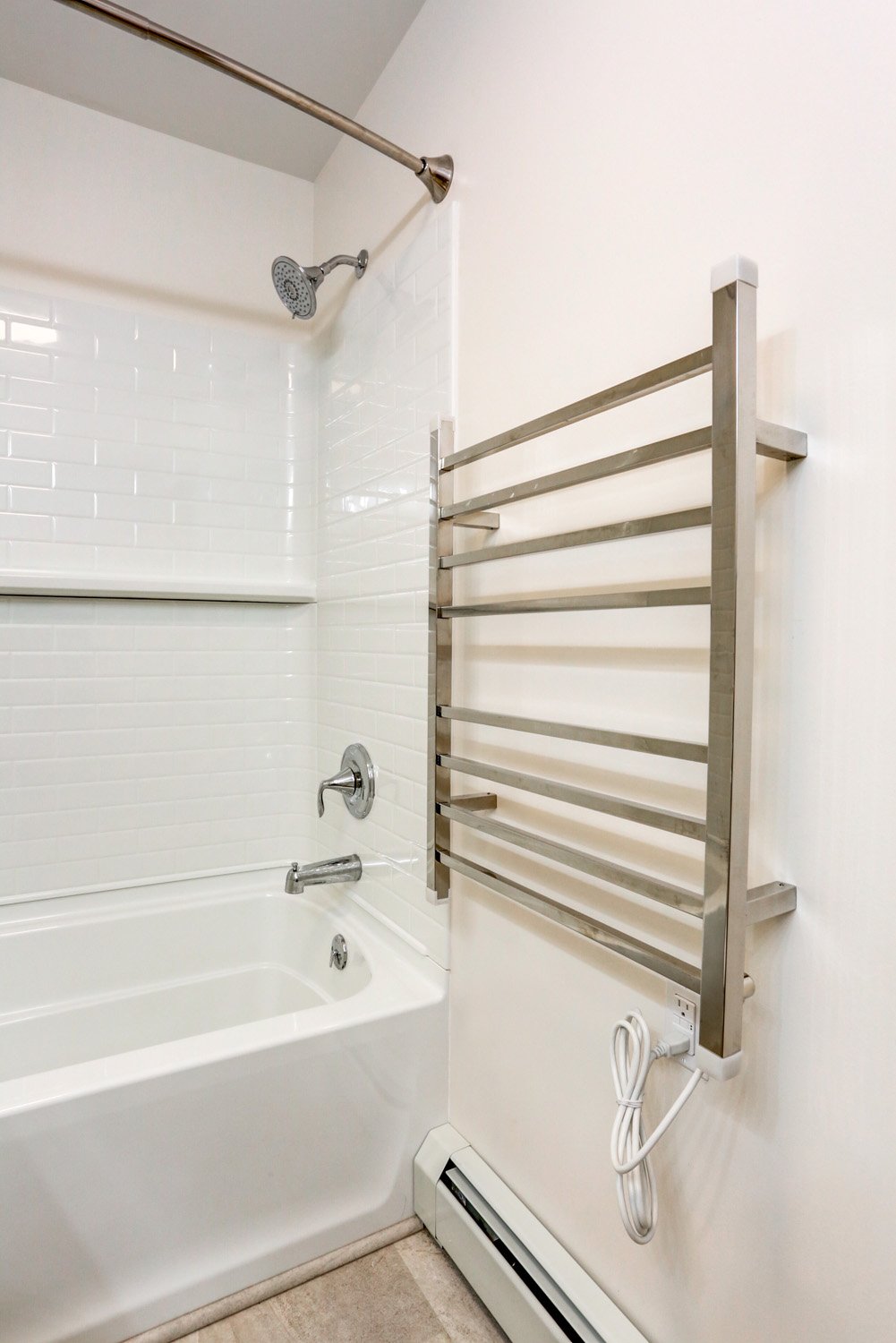 Bloomingdale guest bathroom remodel with towel warmer accessory