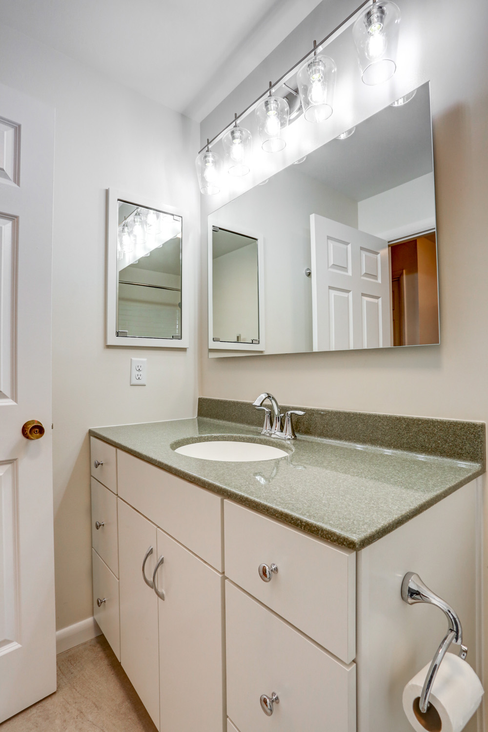 White cabinet vanity in Bloomingdale guest bathroom remodel