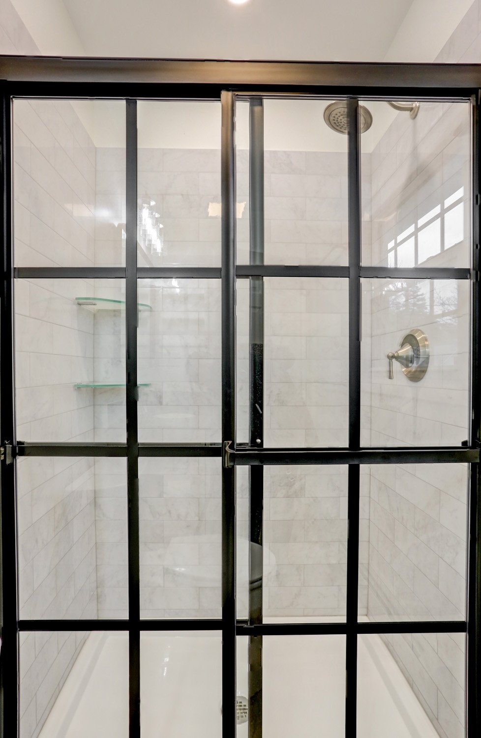 Custom Sliding matte black shower doors with grids in Bloomingdale Master Bathroom Remodel