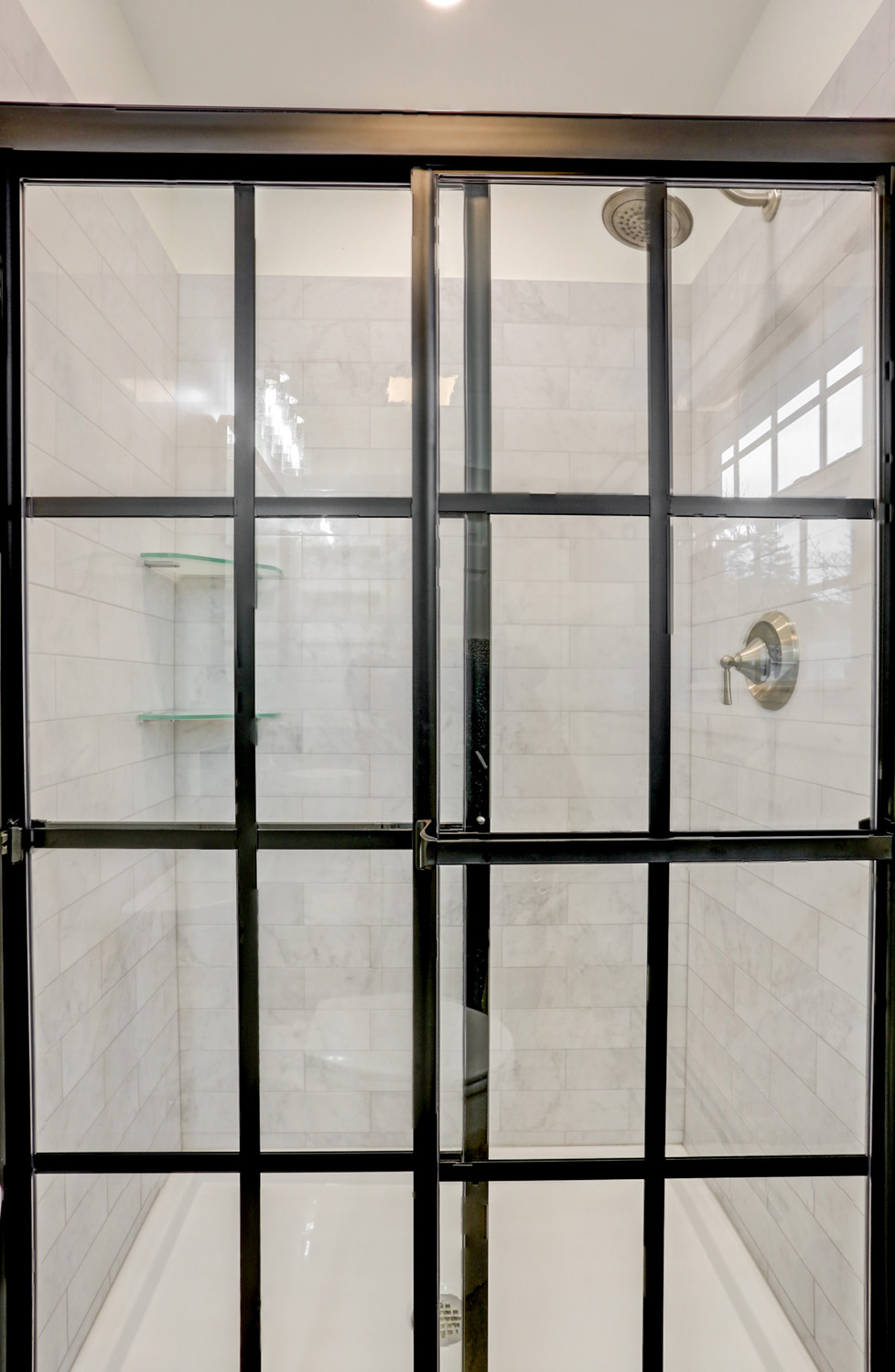 Custom Sliding matte black shower doors with grids in Bloomingdale Master Bathroom Remodel